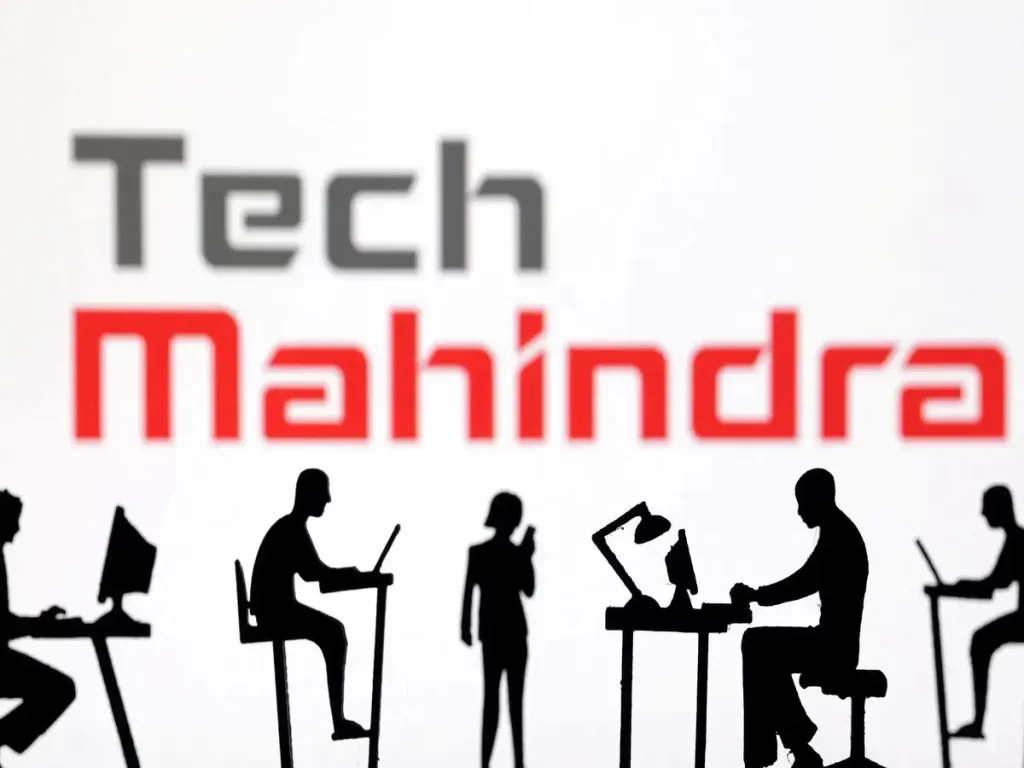Tech Mahindra office building with financial performance charts showing Q2 net profit decline