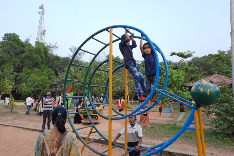 Children playing in a public park in Derebail, highlighting the area’s natural surroundings and community-friendly environment near the upcoming Mangaluru IT Park location
